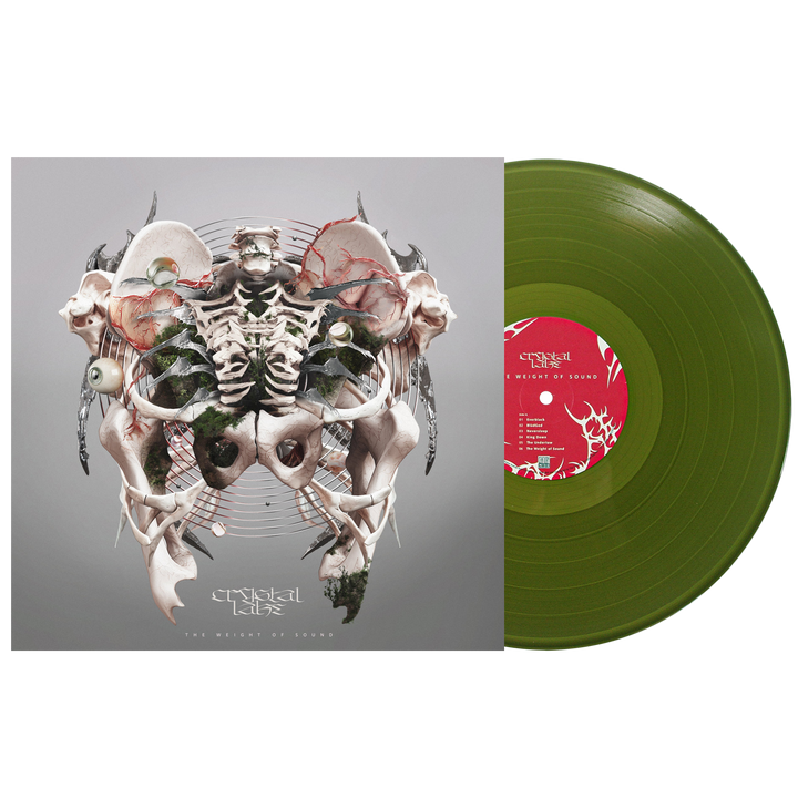 An olive green EVERBLACK vinyl by Crystal Lake sits beside its album cover, showcasing a surreal collage of bones and animal elements on gray. The red label features white album text, LP tracklist, and abstract designs.