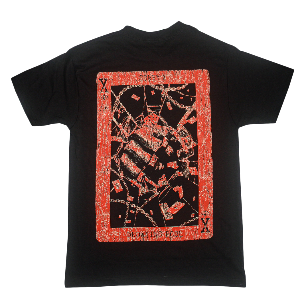 Black T-shirt from Sorry X, crafted from 100% U.S. cotton for everyday comfort with a relaxed fit. The back features a bold rectangular graphic outlined in red, displaying abstract, chain-inspired patterns reminiscent of playing card designs—exemplifying the quality and style synonymous with Sorry X tees.