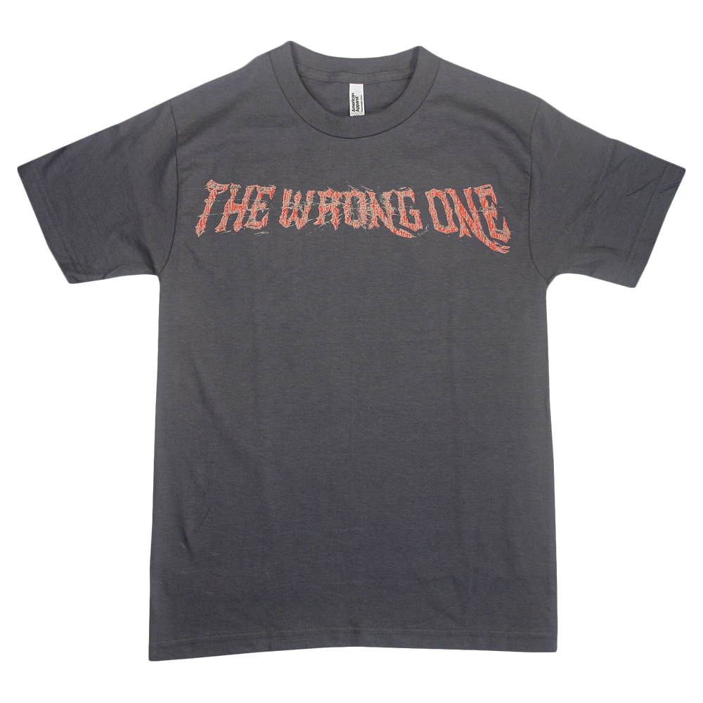 A dark gray Sorry X T-shirt crafted from premium U.S. cotton, featuring “THE WRONG ONE” in jagged red and white lettering across the chest. Its relaxed fit guarantees all-day comfort and effortless style.