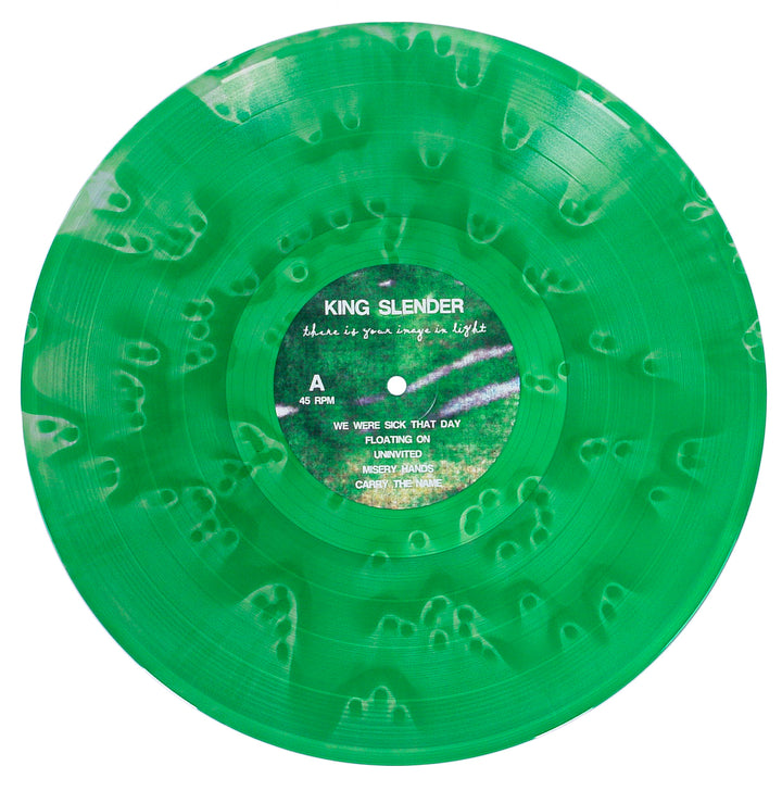 A translucent green marbled vinyl by King Slender, titled “blue is your every light,” features a unique swirled pattern around the label and tracklist on side A.