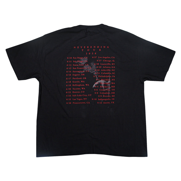 Black Comfort Colors t-shirt with NEVERENDING TOUR 2026 and a list of tour dates and cities printed in red on the back.