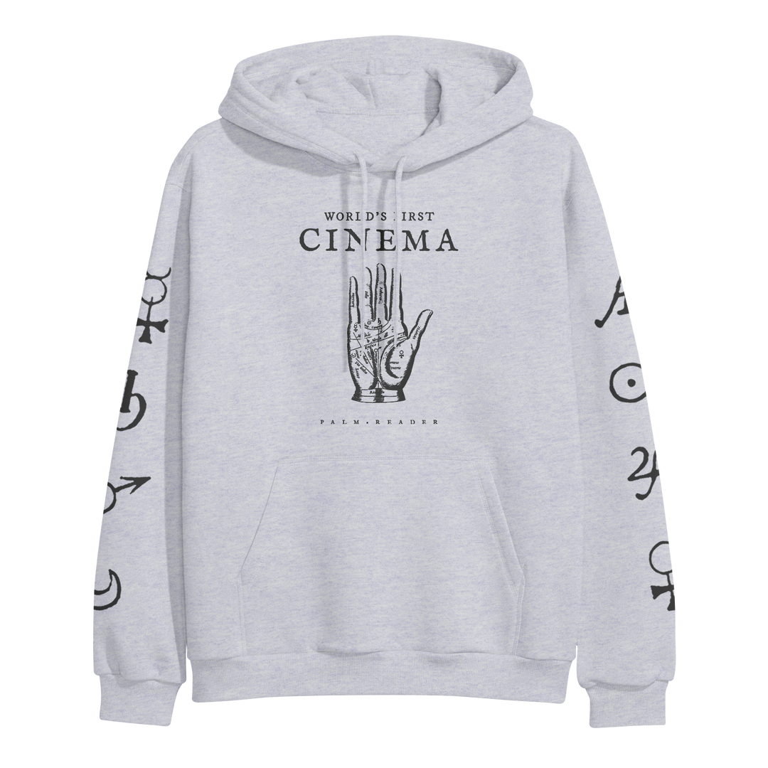 Light gray World's First Cinema heavyweight pullover hoodie with a palmistry hand and WORLDS FIRST CINEMA text on the front, black symbols on both sleeves, plus front pocket and drawstrings.