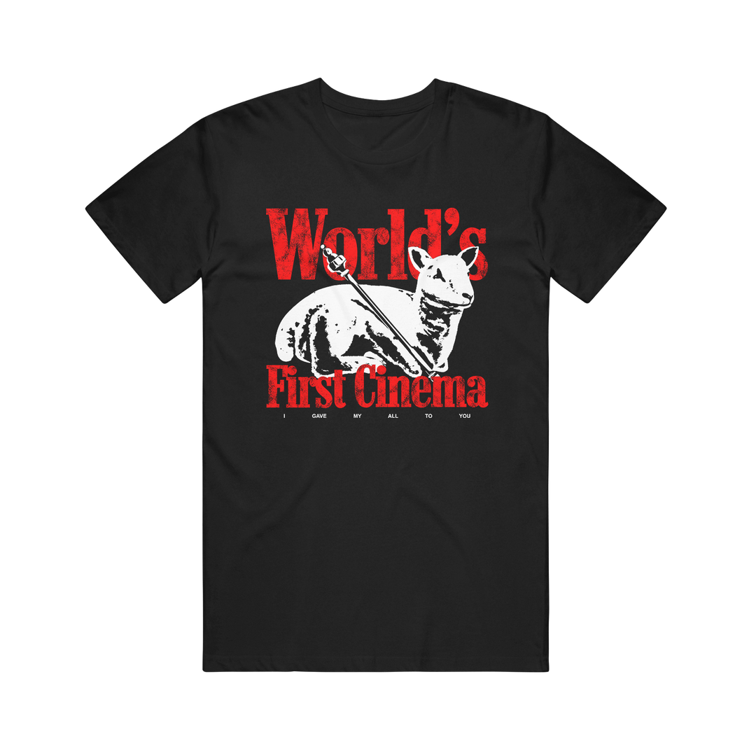 Black Comfort Colors T-shirt by World’s First Cinema featuring a white dog and bird graphic, bold red “World’s First Cinema” text, and smaller “I GAVE MY ALL TO YOU”—a standout pick for fans of unique printed shirts.