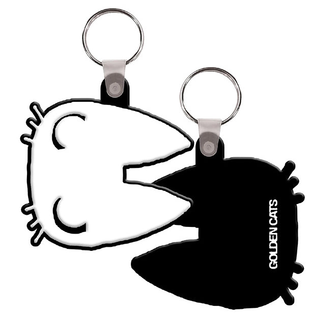 Two puzzle-piece shaped keychains, one white and one black, that fit together to form a cat head silhouette, with the text GOLDEN CATS printed on the black piece.