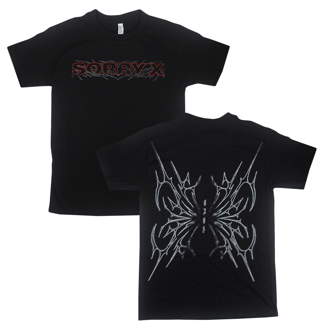 Black t-shirt by Sorry X featuring “SORRY X” in red and gray on the front, and a large abstract spiked white graphic with “GIVEN” text centered on the back. Made from 100% U.S. cotton for superior comfort, this relaxed fit American Apparel tee offers bold style and quality craftsmanship.
