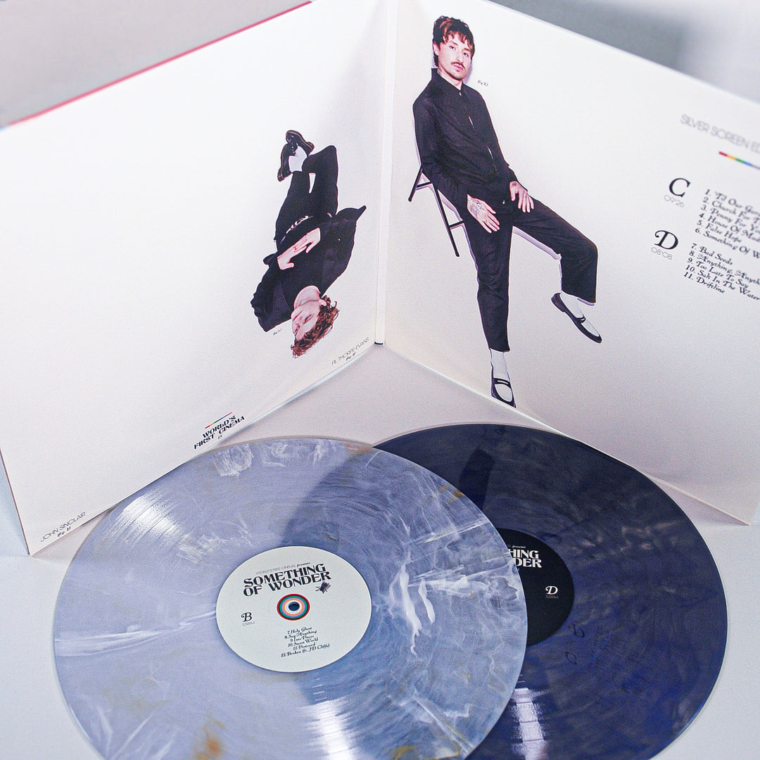 Vinyl records with a person on the cover and text on a white background