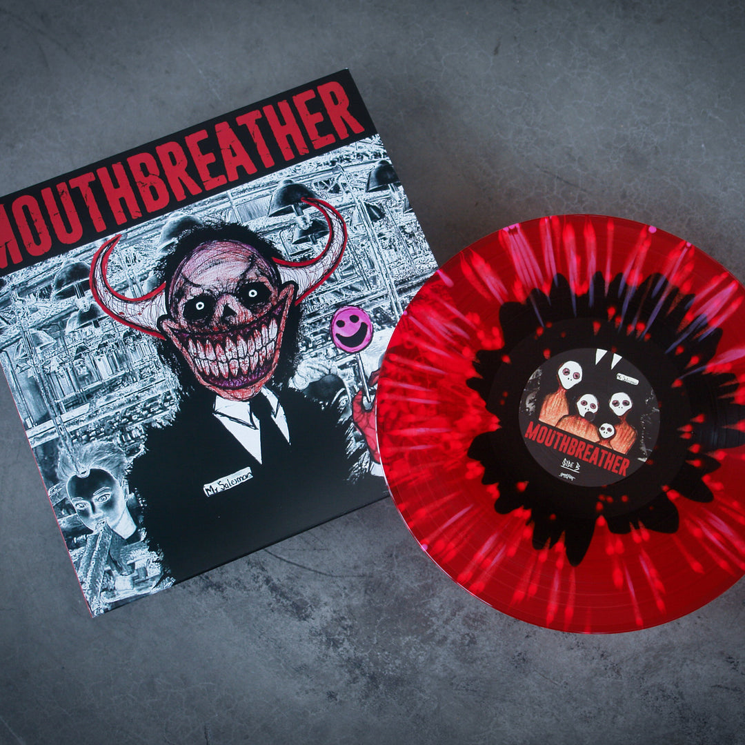 A red and black splatter vinyl record by MouthBreather sits beside its cover, showing a suit-wearing figure with a monstrous grin, red horns, and chaotic art. The "Wasted Life" album released on 9/17/2021 in bold style.