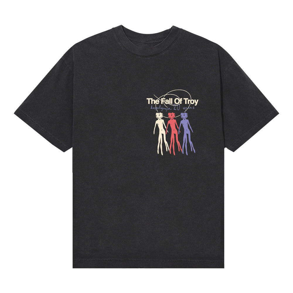 Black American Apparel T-shirt by The Fall of Troy, featuring their name and three outlined humanoid figures in cream, red, and purple below the text, with a faint circular background design—a bold pick for printed tee fans.