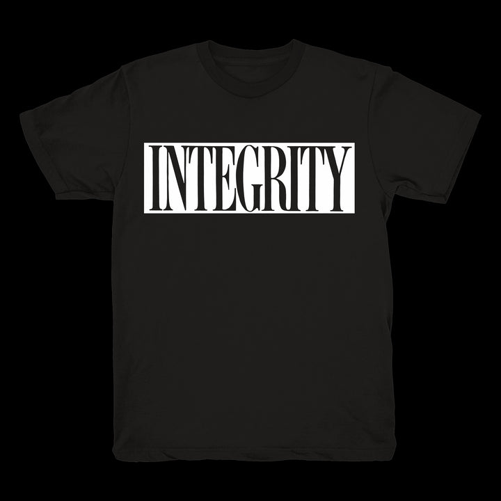 A black Integrity brand Heavy Cotton T-shirt with the word INTEGRITY in bold white all-caps letters inside a white rectangular border on the front.
