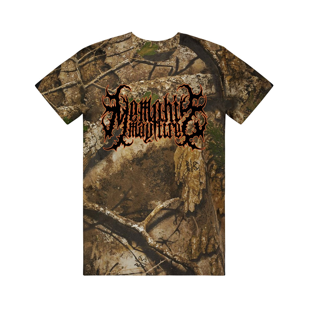 A camo t-shirt by Memphis May Fire featuring a woodland camouflage pattern and an ornate, metal "Homicide Worldwide" logo in bold orange and black across the chest.