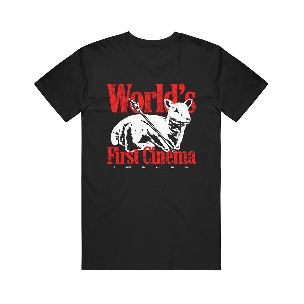 World’s First Cinema black Comfort Colors tee with a white sphynx cat, red “World’s First Cinema” text above and below, and small black text under the cat reading “I gave my all to you.”.