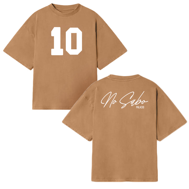 Front and back of a brown Micah Palace Max Heavyweight t-shirt. The front features a large white number 10; the back displays “No Sabo PALACIO” in white script and print on the upper right shoulder.