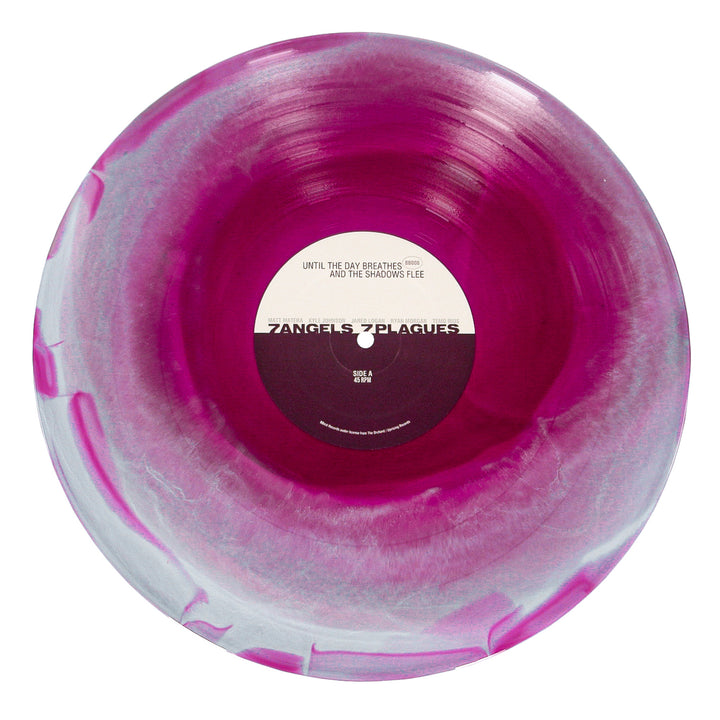 A marbled pink and white vinyl record by 7 Angels 7 Plagues, with a Tri Color Merge look. The black and white center label features the brand name, smaller text, and album details above and below.