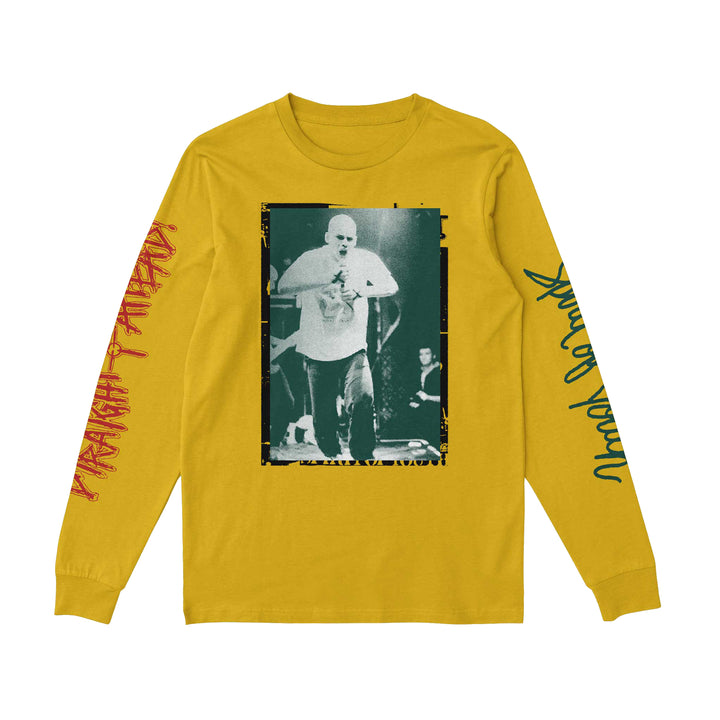 The Straight Ahead mustard yellow Comfort Colors long-sleeve shirt features a black-and-white performer photo and red and green sleeve designs. Presale available now—secure yours before shipping begins!.