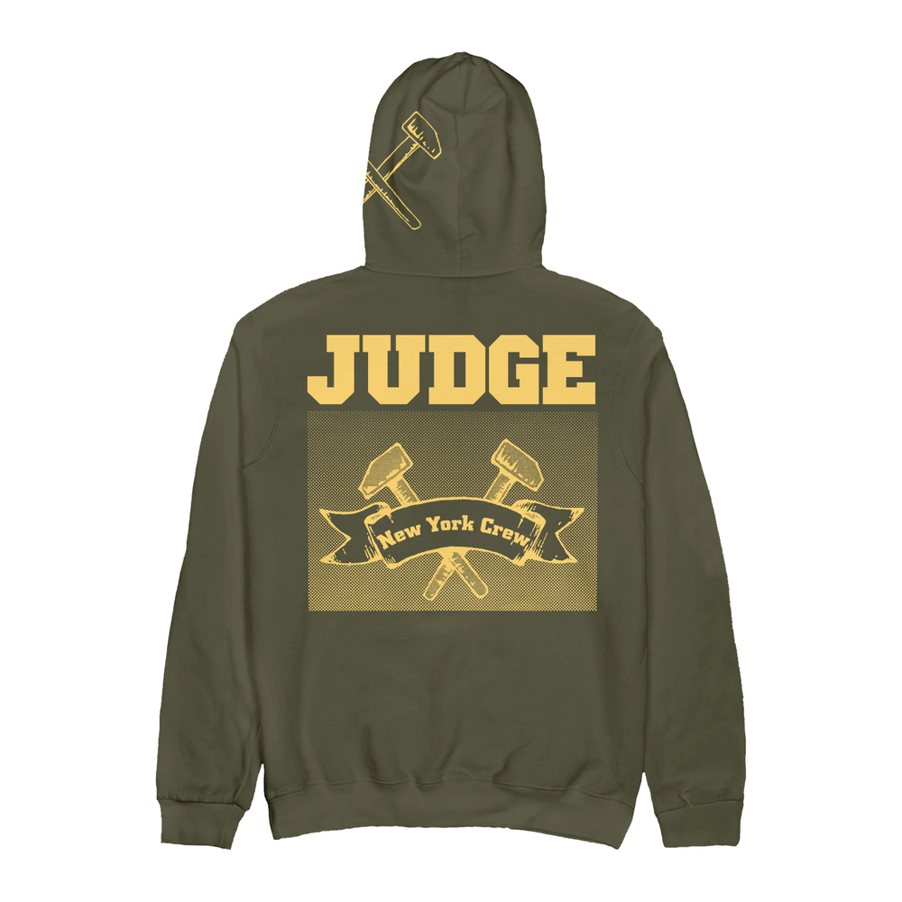 Olive green IND4000 hoodie featuring the text JUDGE above a graphic of two crossed hammers and a banner reading New York Crew, with a small hammer icon on the hood.