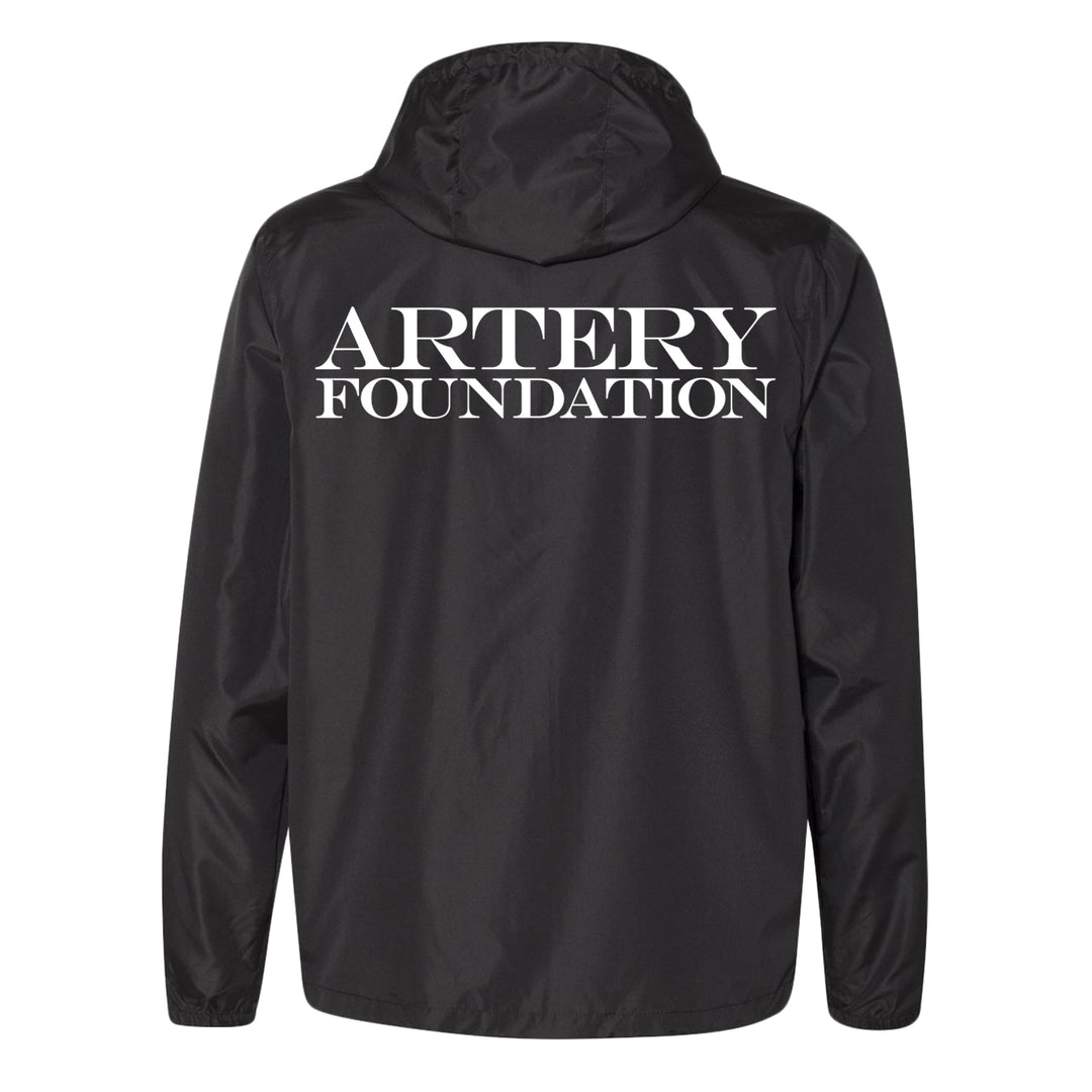 A black lightweight windbreaker by Artery Foundation, shown from the back, with "ARTERY FOUNDATION" printed in bold white letters across the upper back.