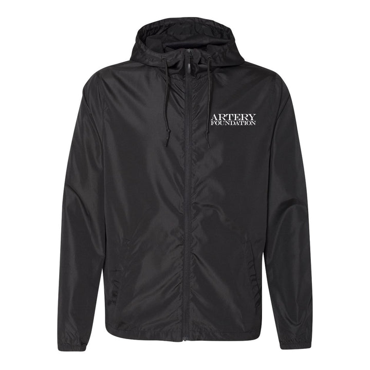 A black lightweight windbreaker from Artery Foundation with the brand printed in white on the left chest. This zip-up jacket features a hood with drawstrings and side pockets, making it perfect for layering.