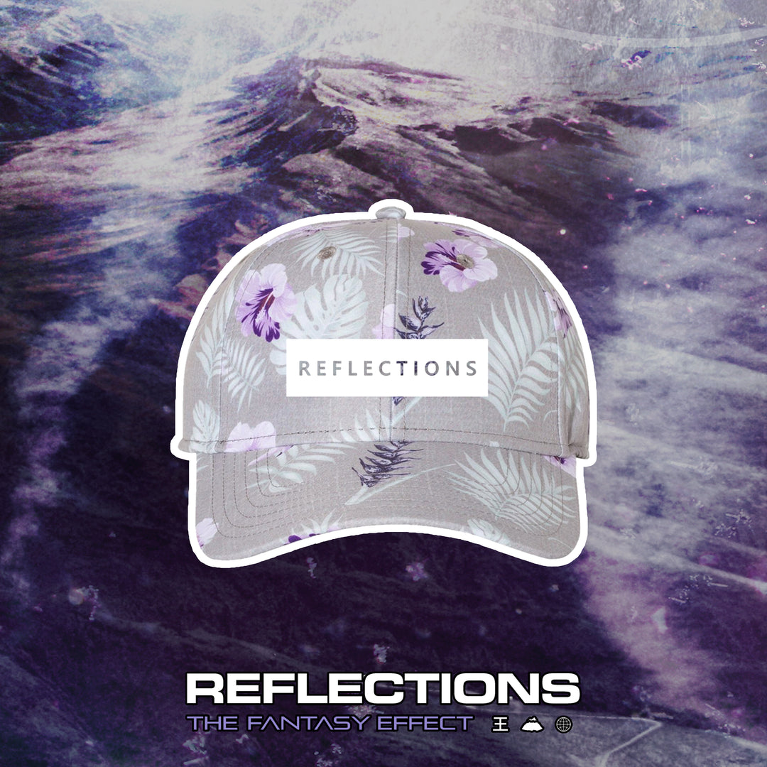 A gray and lavender floral cap with a Reflections label is centered on a purple abstract water background. At the bottom, “Reflections: The Fantasy Effect” appears with small icons alongside.