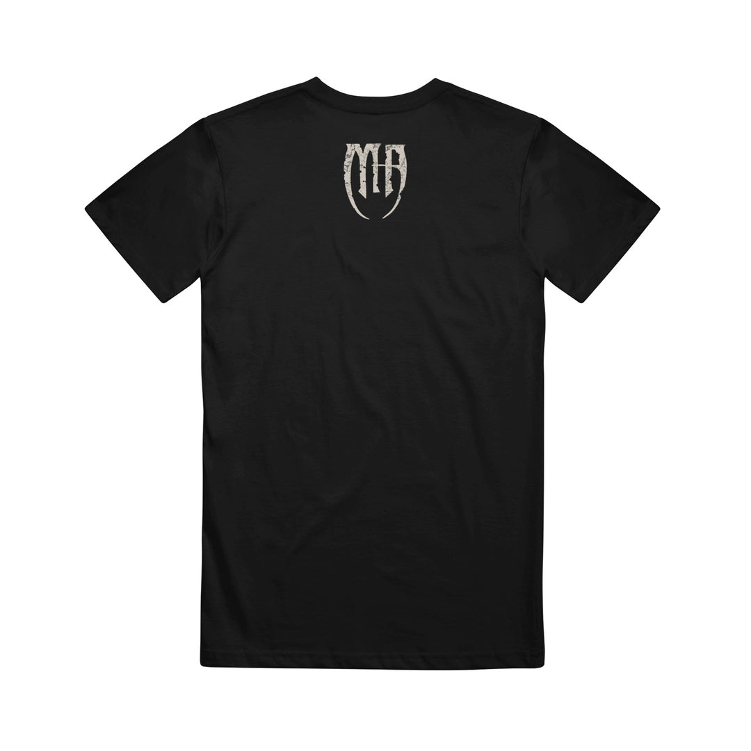 Black Melrose Avenue ASColour 5001 T-shirt shown from the back, featuring a small white stylized MH logo near the upper center below the neckline. This plain, regular fit combed cotton tee has no other visible designs or text.