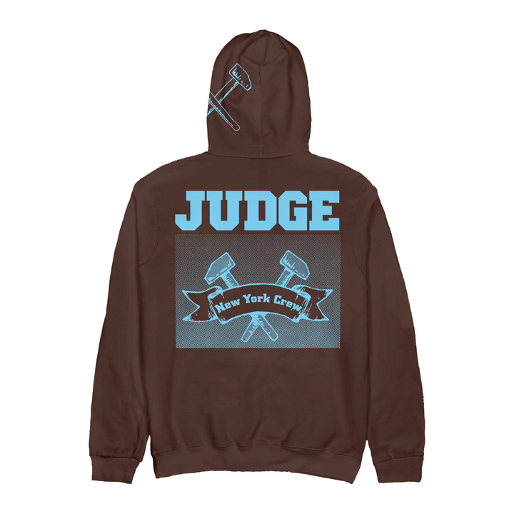 Brown IND4000 hoodie with light blue graphics including the word JUDGE, crossed hammers, and a ribbon reading New York Crew.