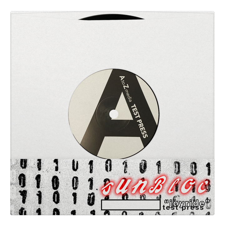 A vinyl record in a white sleeve with binary code and "SUNBLOC" in red text. The label displays a large A, "A to Zendos TEST PRESS," and suggests the alternative music style of Sunbloc’s Joyride EP.