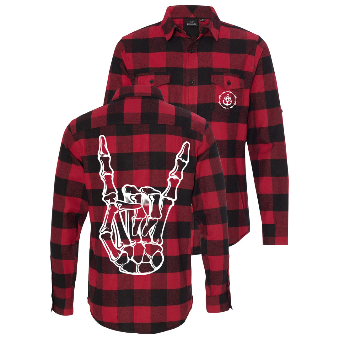 Stay Sick Clothings red and black plaid flannel shirt features a white skeleton hand flashing metal horns on the back and a small white anchor logo on the front left chest pocket—perfect for fall and winter.