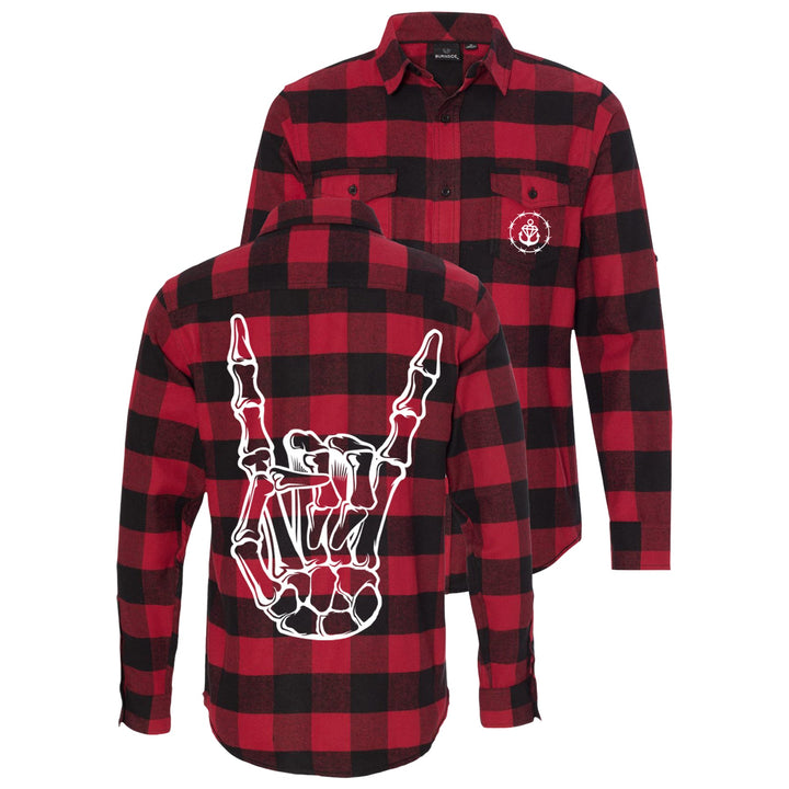 Stay Sick Clothings red and black plaid flannel shirt features a white skeleton hand flashing metal horns on the back and a small white anchor logo on the front left chest pocket—perfect for fall and winter.