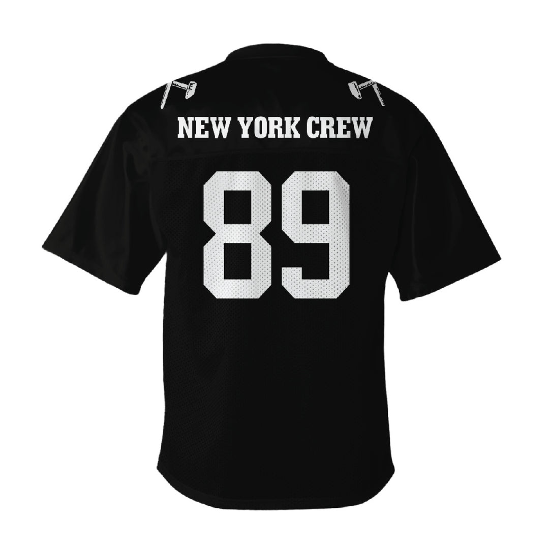 A Judge brand black sports jersey with a v-neck collar, "NEW YORK CREW" in bold white letters above a large white number 89 on the back, made from breathable polyester tricot mesh for comfort.