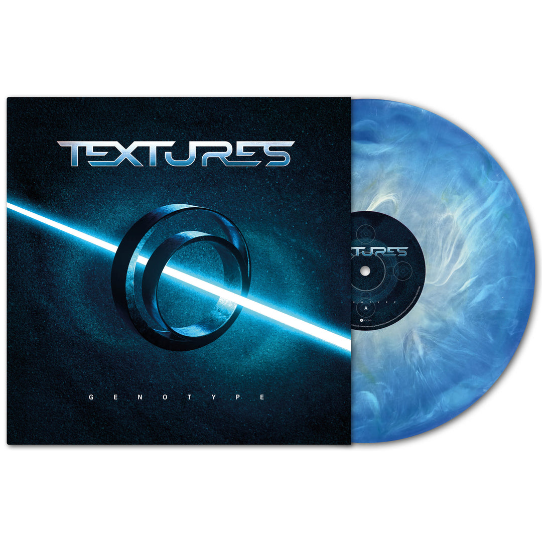 A blue and white marbled progressive metal vinyl by Textures partially slides from its sleeve. The cover displays a glowing ring, bright diagonal light, and "Textures Genotype"—Dutch progressive metal at its finest.