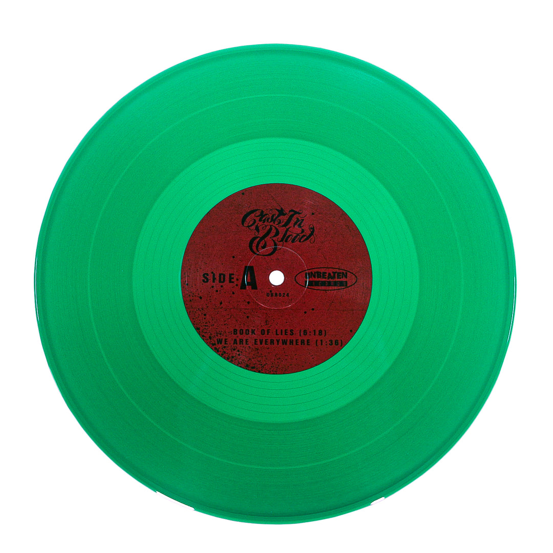 Green vinyl record with red label on a white background