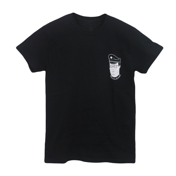Castle Jackal black Comfort Colors t-shirt featuring a small white line drawing of a person with glasses, peaked cap, and chain necklace on the left chest. Available for pre-order.