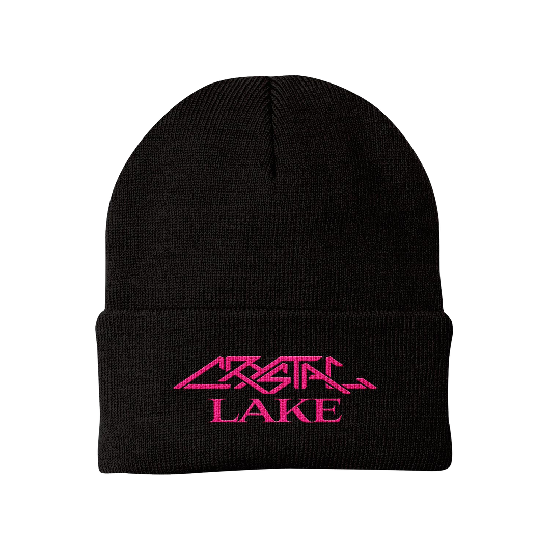 The Crystal Lake Sportsman Cuffed Beanie is black with CRYSTAL LAKE embroidered in bright pink, stylized lettering on the folded brim. Made from 100% acrylic for comfort and durability.