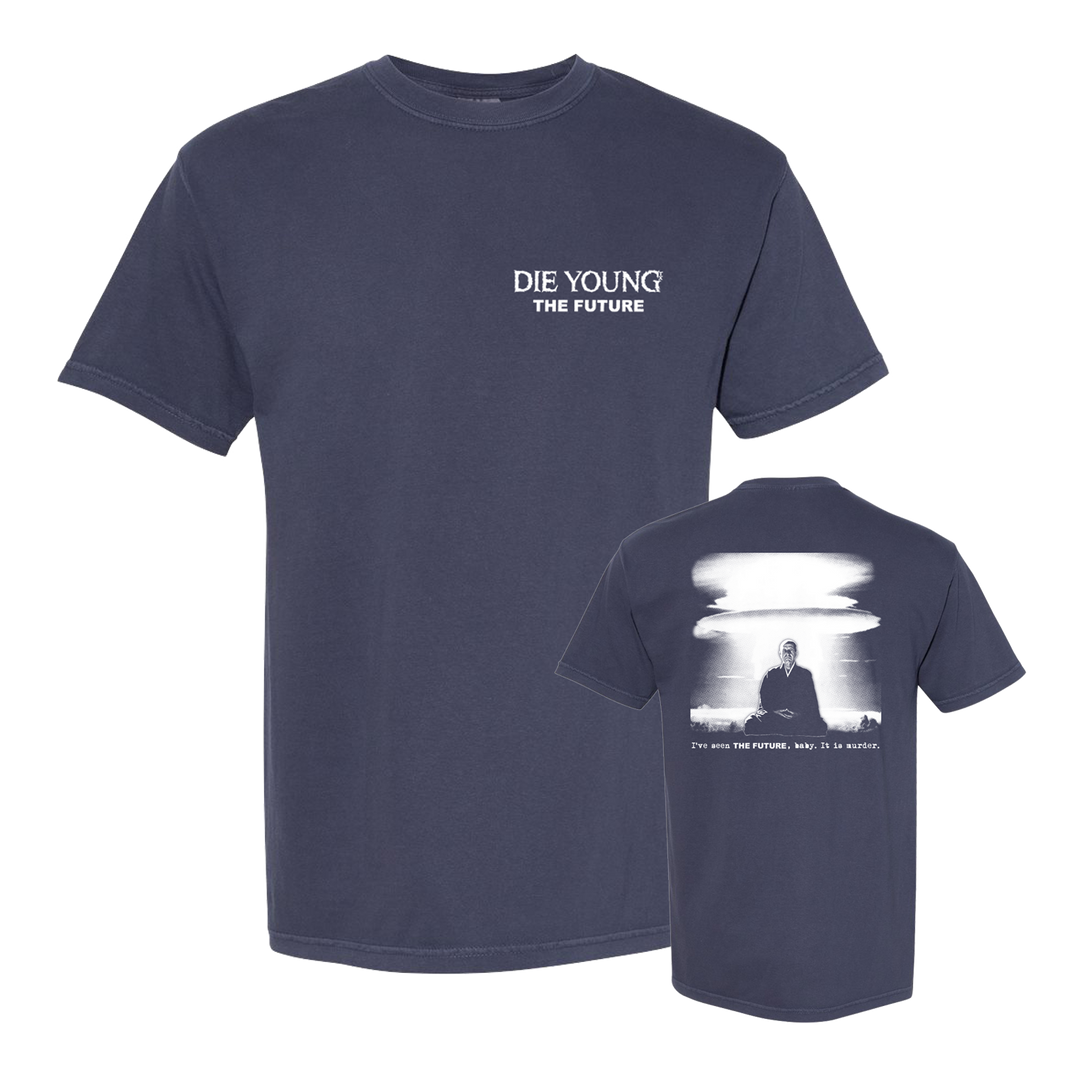 A navy blue Comfort Colors t-shirt by Die Young features "DIE YOUNG THE FUTURE" on the front left chest and a grayscale image with the text "You are the future, why be in haste." on the back.