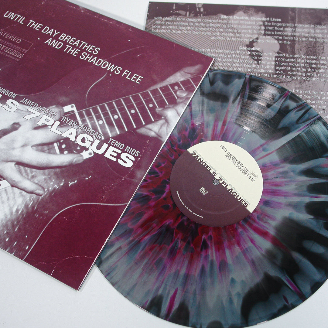 A marbled grey, black, and purple splatter vinyl by 7 Angels 7 Plagues is partly out of its cover, which shows a close-up of hands playing guitar and the text “Until The Day Breathes and the Shadows Flee.”.