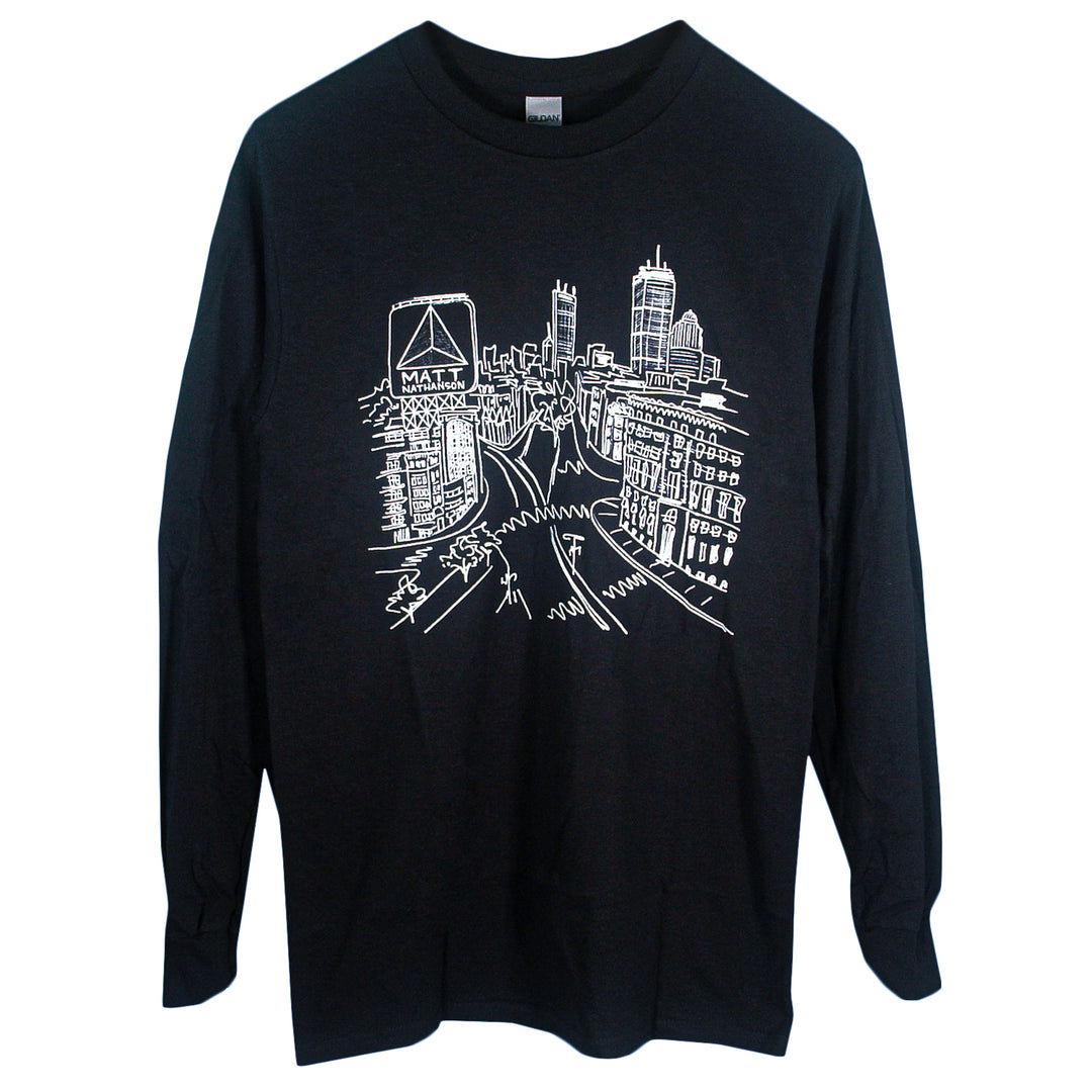 Black Matt Nathanson long-sleeve shirt featuring a printed white line drawing of a cityscape with skyscrapers, buildings, and people walking along busy streets.
