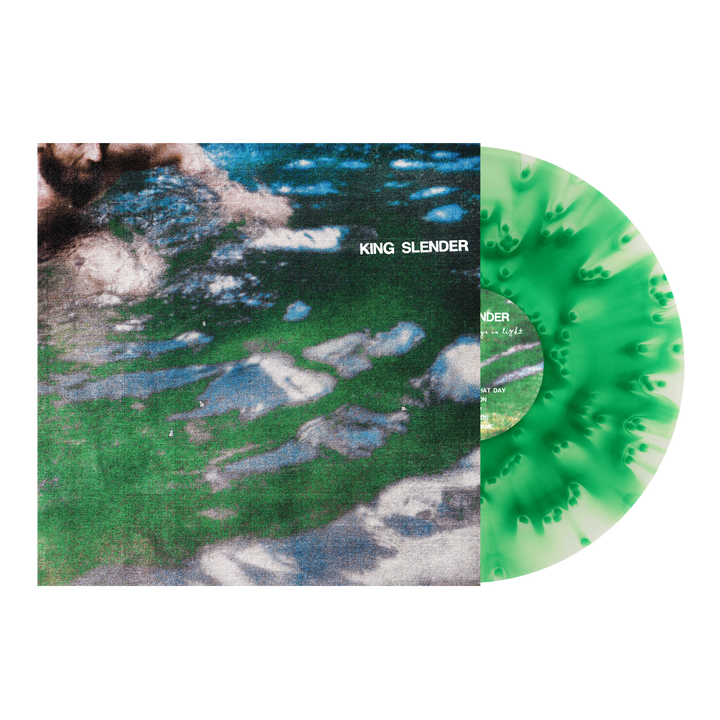 A green and white splatter vinyl by King Slender slides out of its cover, featuring an abstract, green-tinted water image with the band's name in white—ideal for emotional hardcore fans.