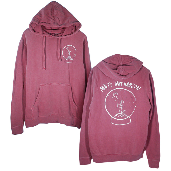 A mauve Matt Nathanson hoodie with a white line drawing of a person in a snow globe on front and back, plus “Matt Nathanson” above the design, makes this pullover unique.