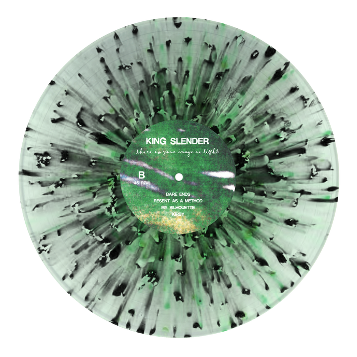 A King Slender green and black marbled vinyl, "Where We Once Sang in Light," features emotional hardcore tracks and a sunburst pattern radiating from the center.