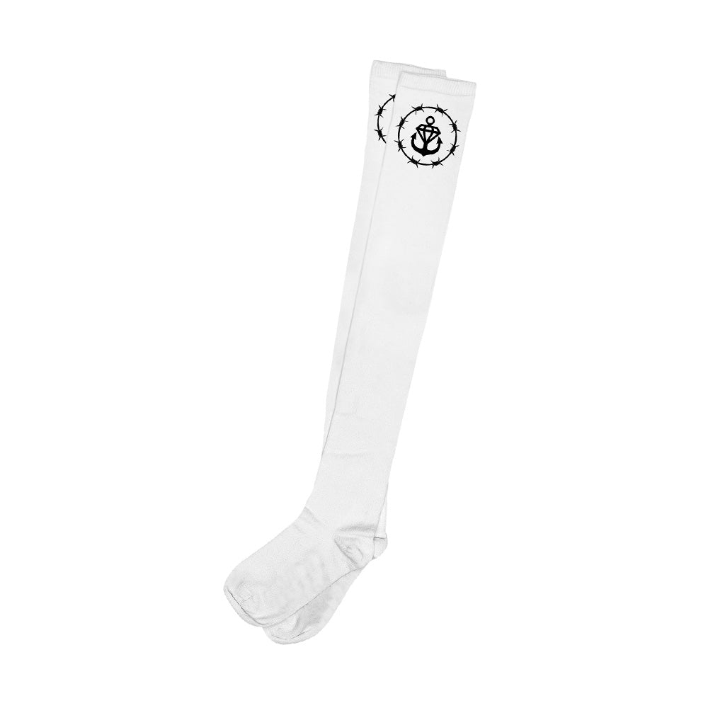 Stay Sick Clothing offers white thigh high leggings with a black anchor and compass design near the top, perfect for bringing a nautical vibe to any womens fashion collection.
