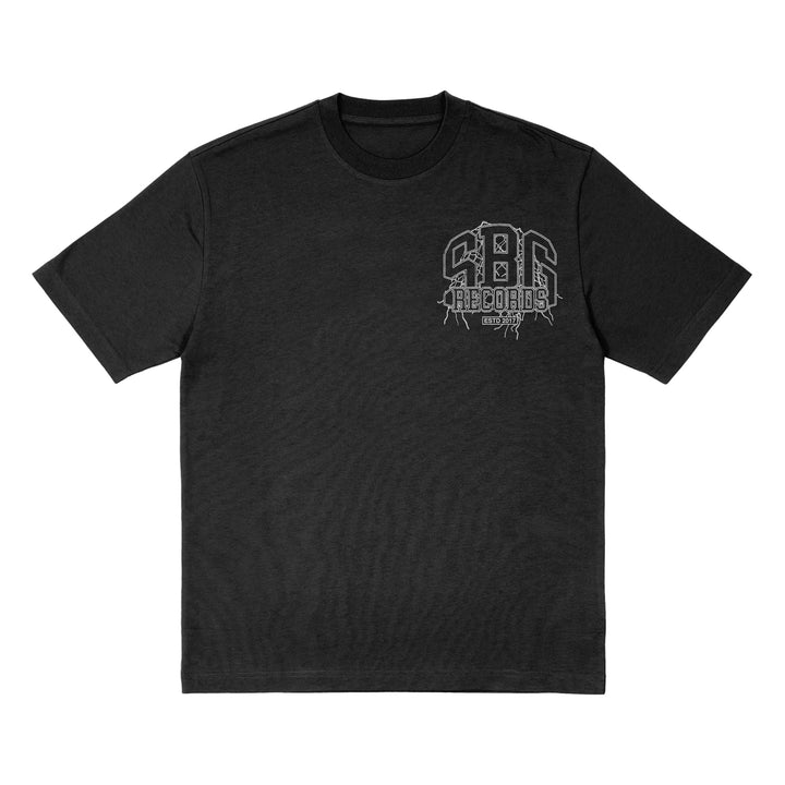 A black American Apparel short-sleeve t-shirt with a white SBG Records logo and graphic on the left chest, laid flat on a white background.