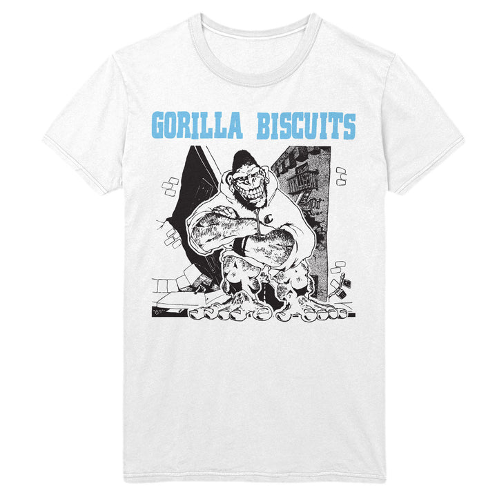 White Gildan Heavy Cotton t-shirt by Gorilla Biscuits featuring a cartoon gorilla hugging a biscuit with distressed buildings behind, and "GORILLA BISCUITS" in large light blue letters above the illustration.