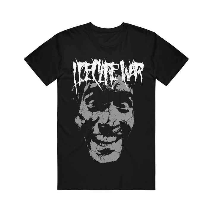 Black Gildan t-shirt by I Declare War featuring a large, distressed grayscale smiling face with exaggerated features. "IDENTITY WAR" is printed above in a jagged, horror-themed font. Bold, statement-making design.
