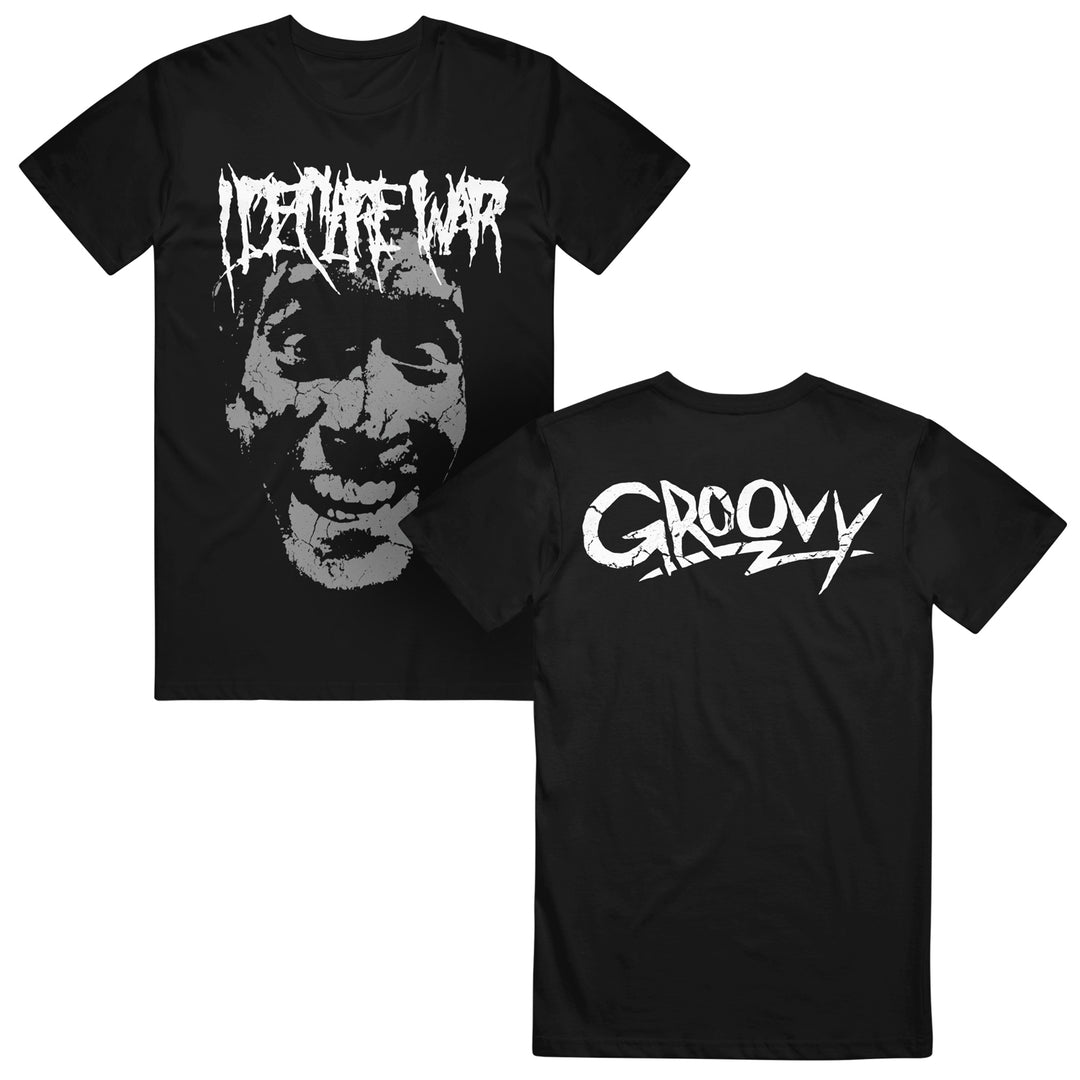 I Declare War black Gildan shirt featuring a distressed, grinning face with "DON’T MAKE WAR" in white graffiti text on the front and "GROOVY" in bold white text on the back.