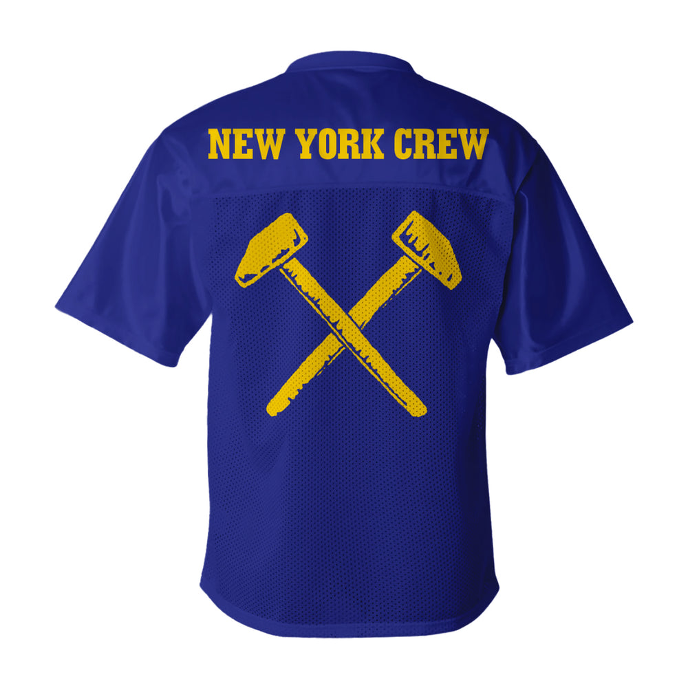 The Judge blue short-sleeve jersey features "NEW YORK CREW" in yellow across the back with two crossed yellow hammers underneath. Pre-order now to receive yours by 11/28/25.
