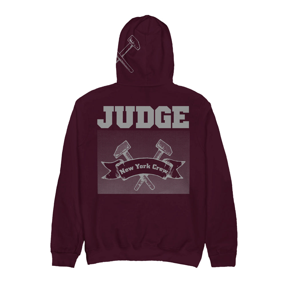 A maroon Judge heavy cotton hoodie featuring bold gray JUDGE text on the back, two crossed gavels, and a New York Crew banner. Presale is live now—ships 11/28/2025.