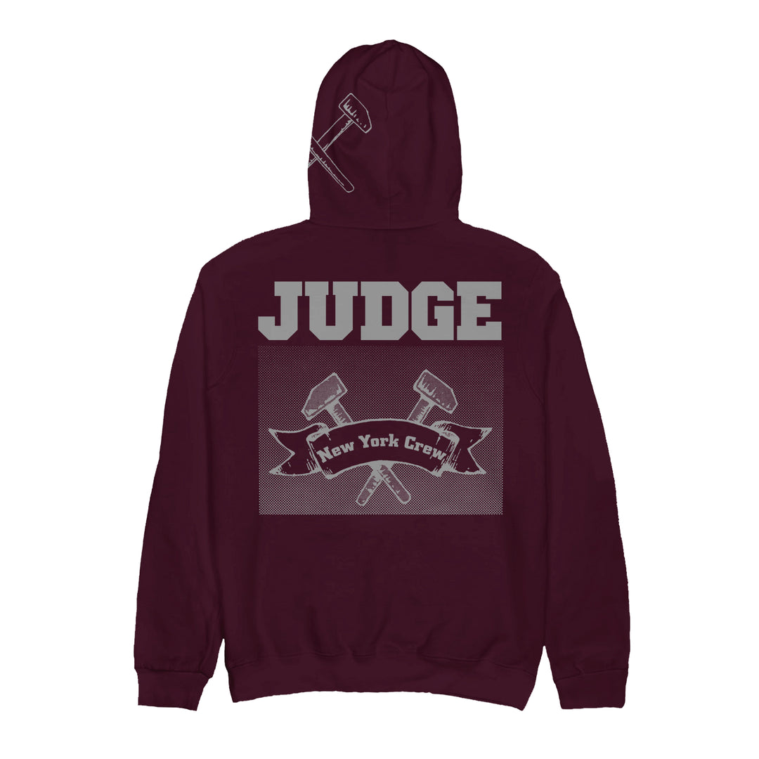 A maroon Judge heavy cotton hoodie featuring bold gray JUDGE text on the back, two crossed gavels, and a New York Crew banner. Presale is live now—ships 11/28/2025.