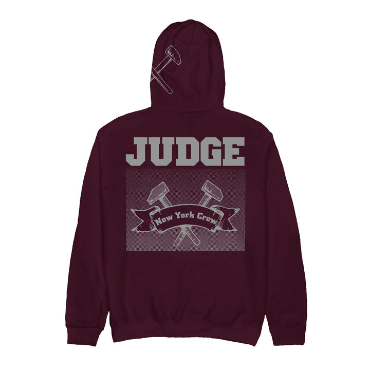 A maroon Judge heavy cotton hoodie featuring bold gray JUDGE text on the back, two crossed gavels, and a New York Crew banner. Presale is live now—ships 11/28/2025.
