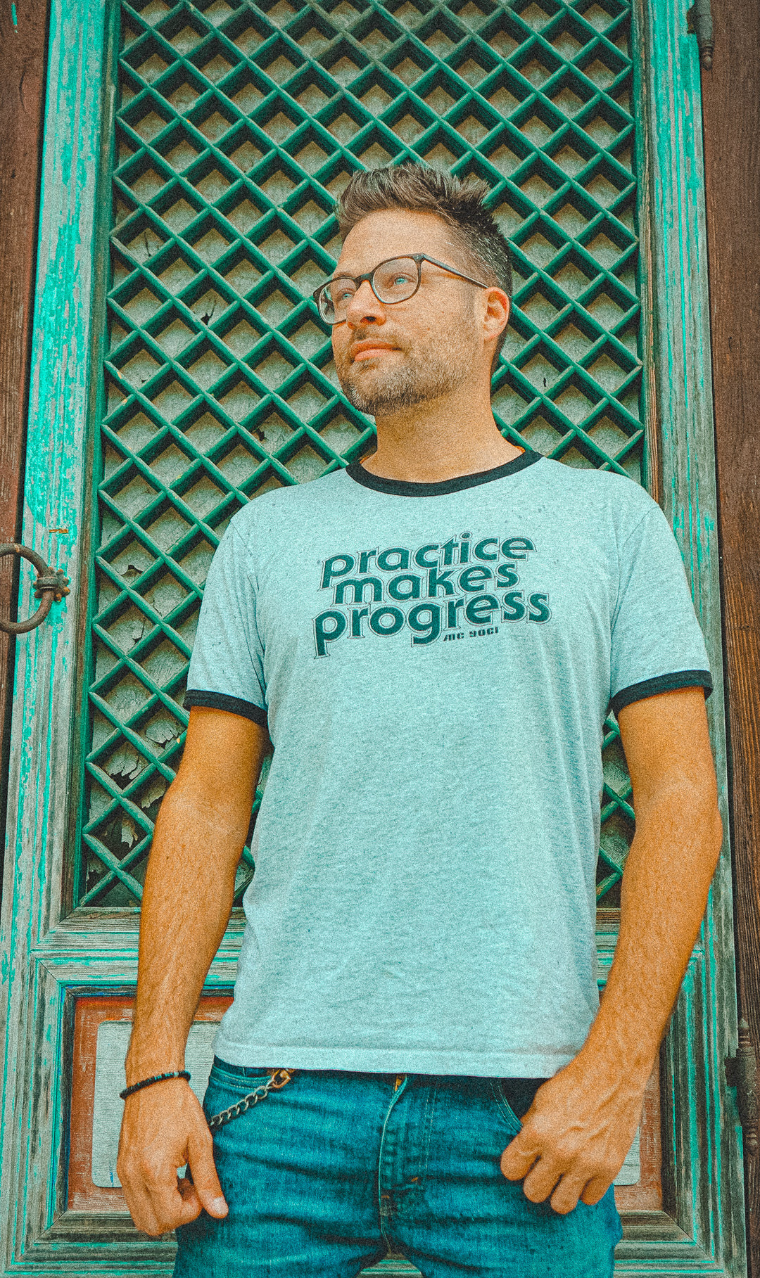 man wearing mc yogi Practice Makes Progress - Grey/Black Ringer Tee