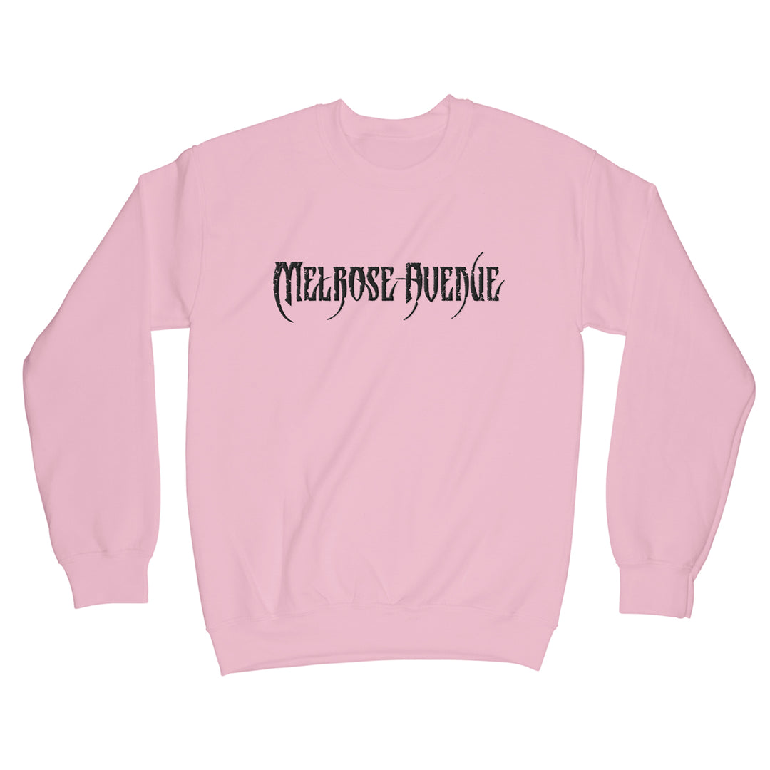 A light pink midweight crewneck sweatshirt from Melrose Avenue, featuring Melrose Avenue embroidered in bold, black gothic font across the chest.