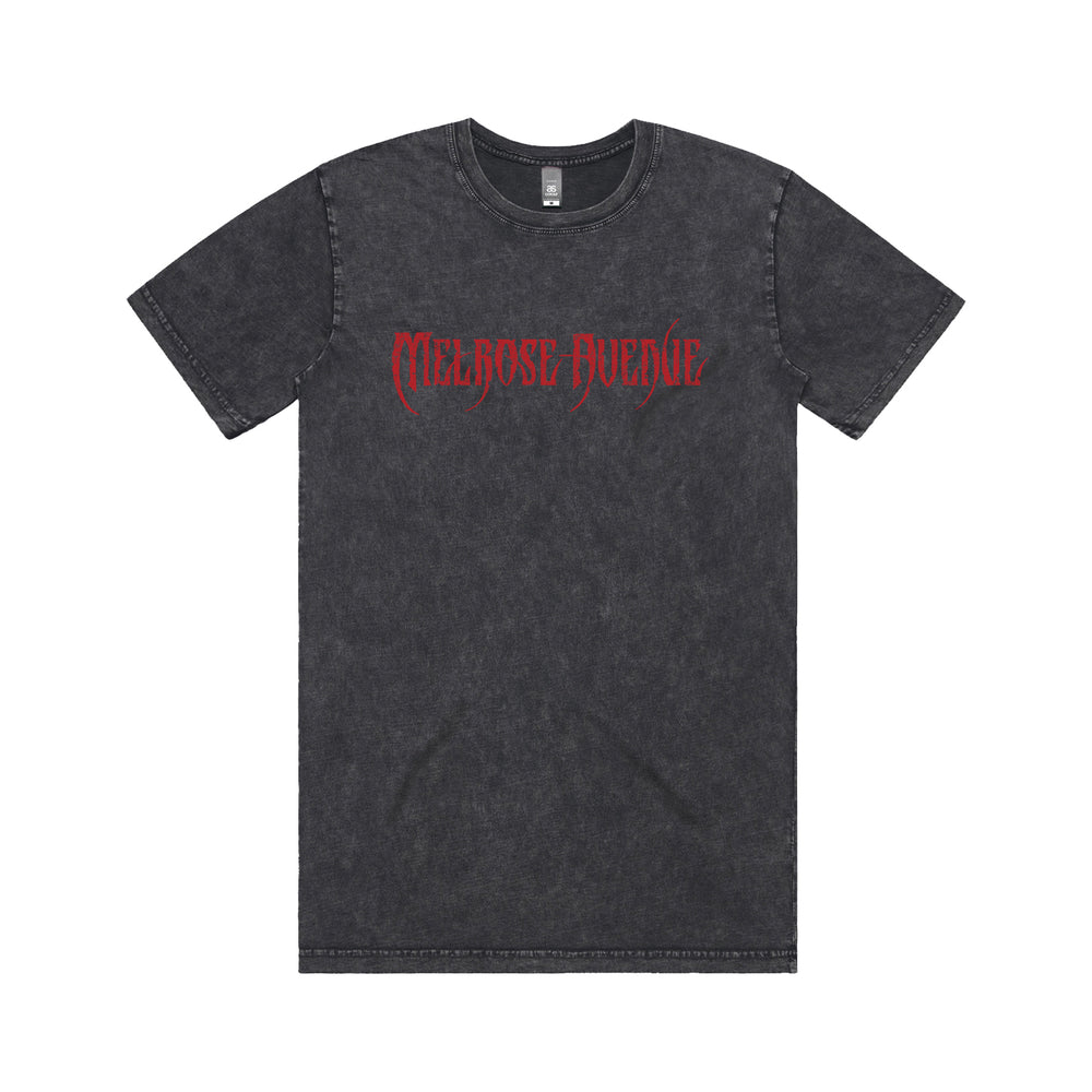 A black acid-wash tee from Melrose Avenue, featuring “Melrose Avenue” in red gothic font across the chest, displayed on a white background.